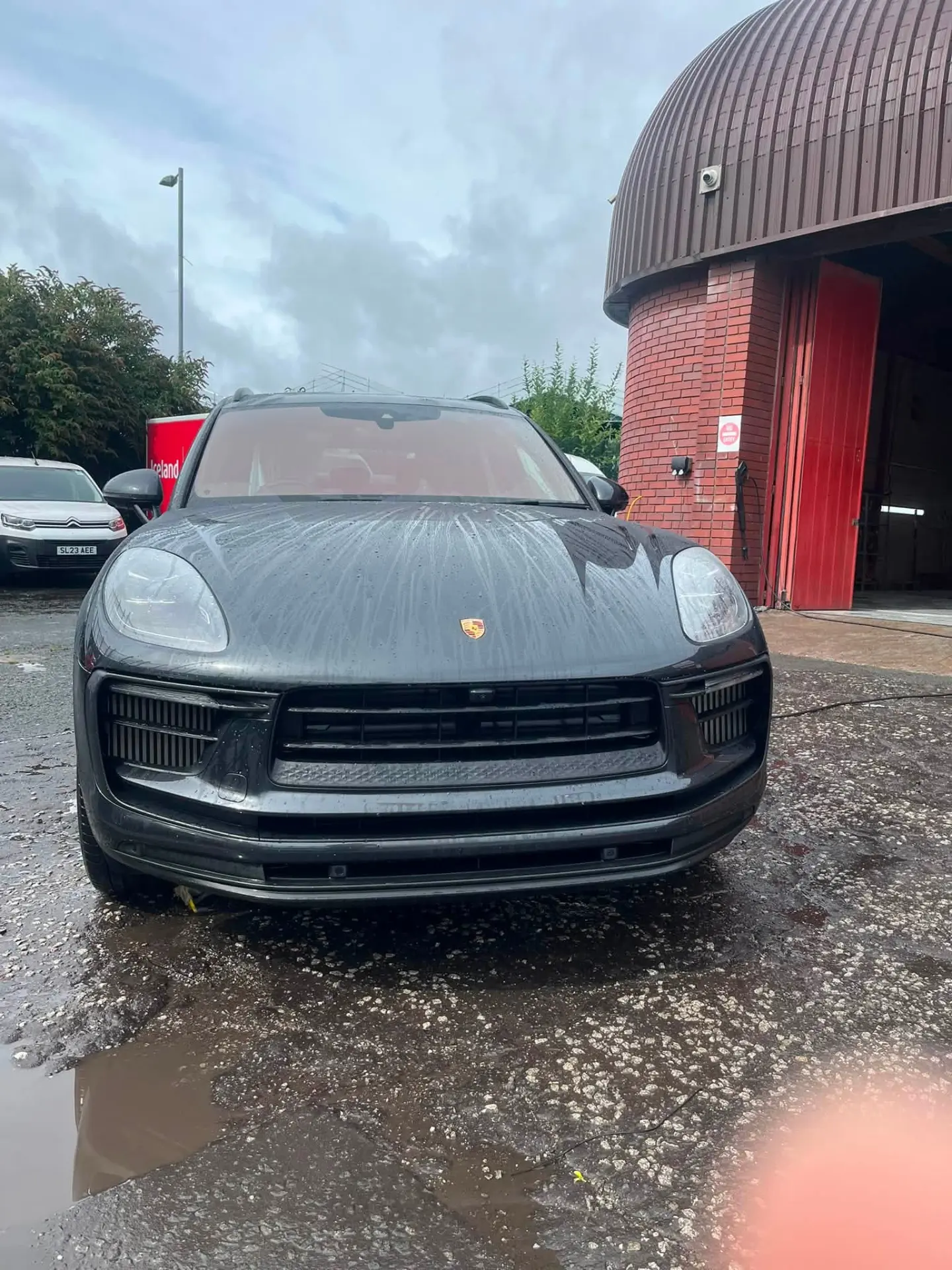 Porsche Macan outside the Spartan Auto Repair workshop
