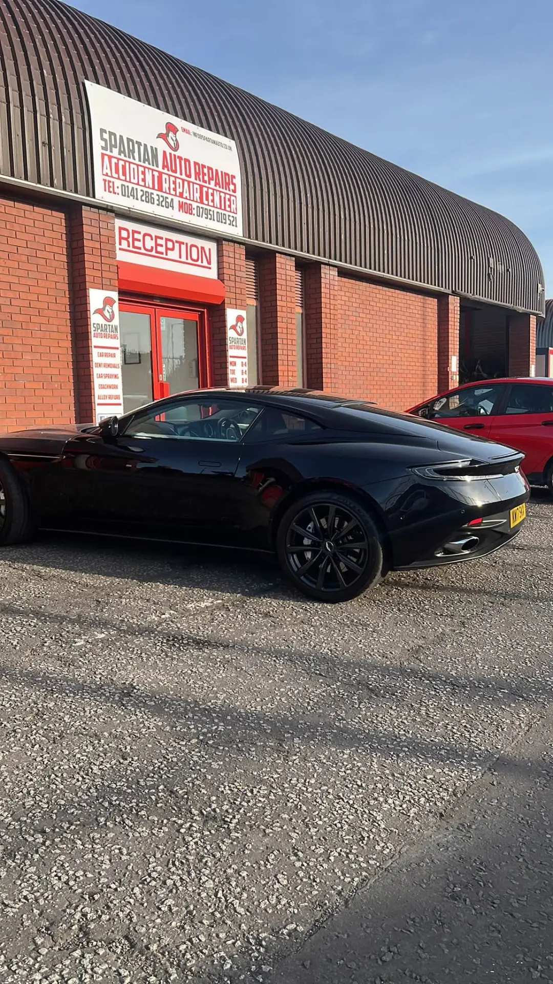 Aston Martin outside the Spartan Auto Repair reception