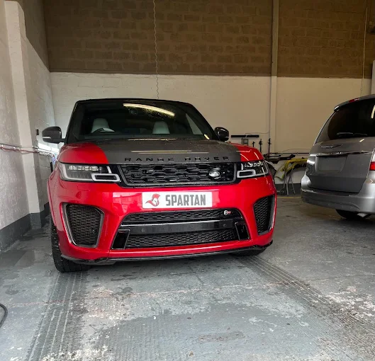 Red Range Rover in the Spartan Auto Repair workshop